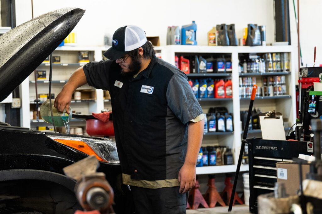 Technician working under the hood